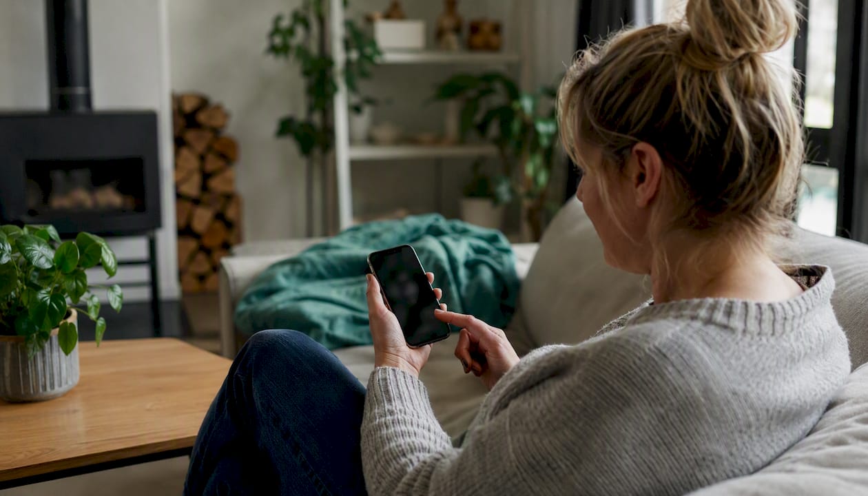 Person interacting with budget app on phone